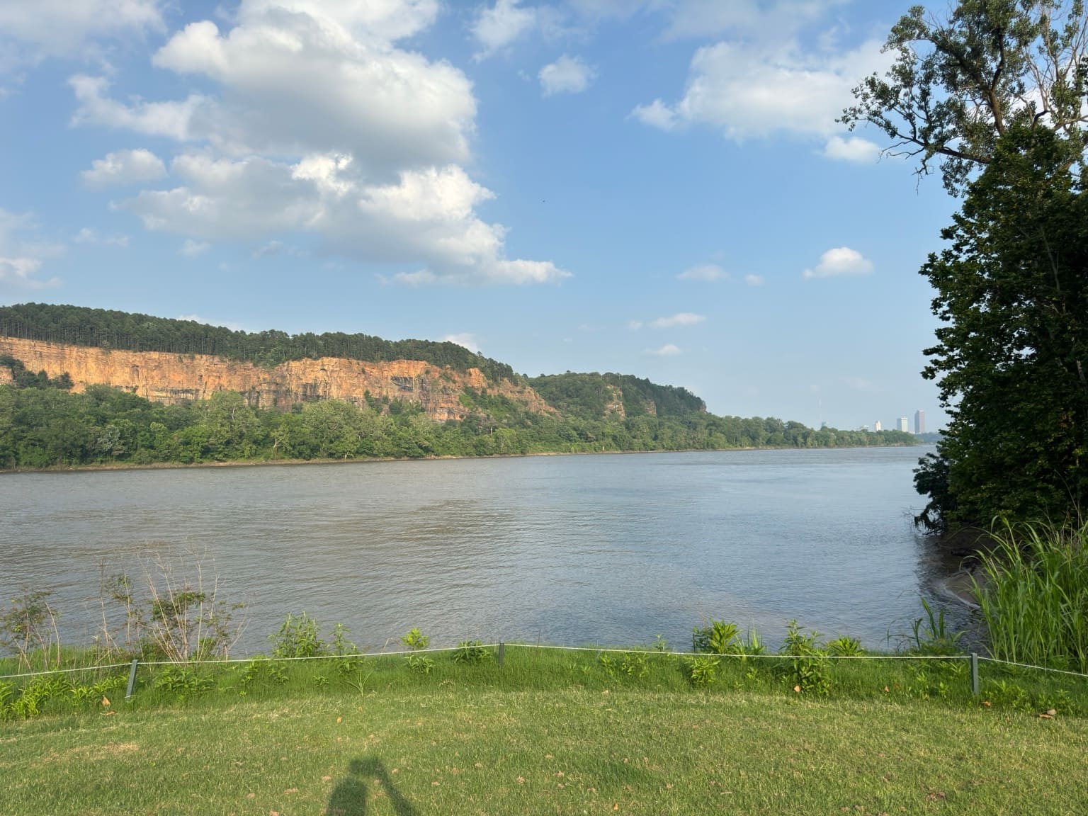 The Arkansas River and tree-lined bluffs seen from Rebsamen Park